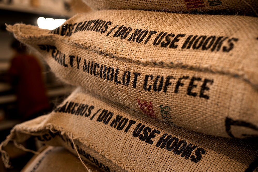 Coffee bags with text indicating they are filled with microlot coffee